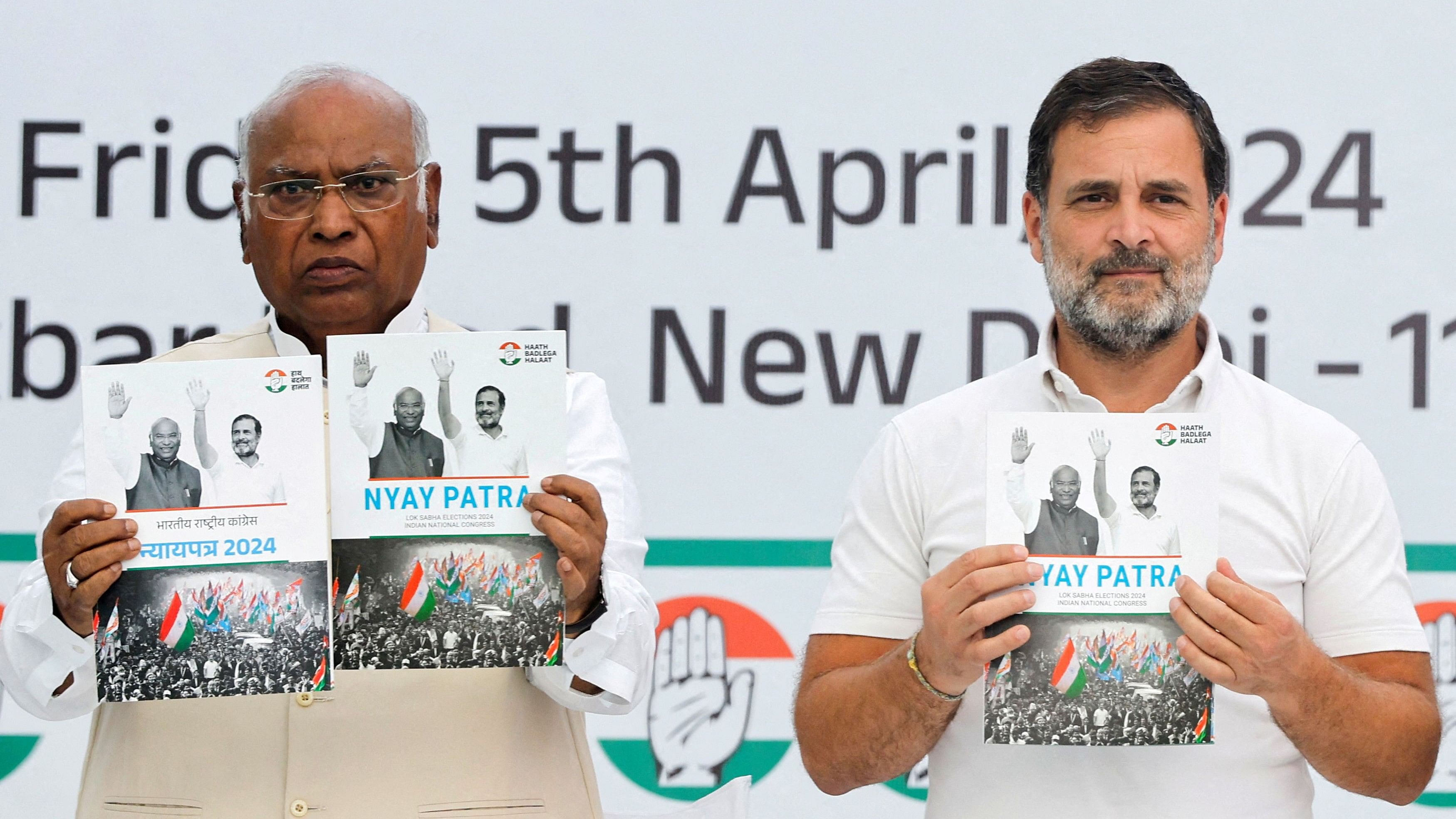 <div class="paragraphs"><p>Congress leaders Mallikarjun Kharge (L) and Rahul Gandhi (R) unveil the party's Lok Sabha election manifesto, New Delhi, April 5, 2024.</p></div>