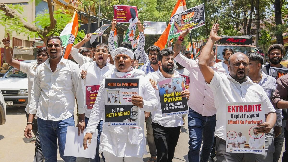 <div class="paragraphs"><p>Indian Youth Congress President B V Srinivas with other members raises slogans against JD(S) MP Prajwal Revanna on his alleged involvement in sexual abuse, in Bengaluru.</p></div>