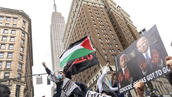 <div class="paragraphs"><p>Demonstrators attend a protest demanding a ceasefire and the end of Israeli attacks on Gaza, during the ongoing conflict between Israel and the Palestinian Islamist group Hamas, in New York City</p></div>