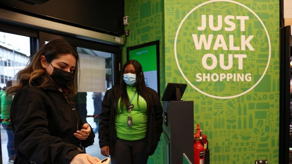 <div class="paragraphs"><p>A customer scans a QR code to enter at the UK's first Amazon Fresh supermarket, in London.</p></div>