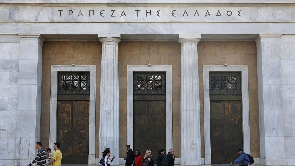 <div class="paragraphs"><p>People walk in front of Bank of Greece in central Athens</p></div>