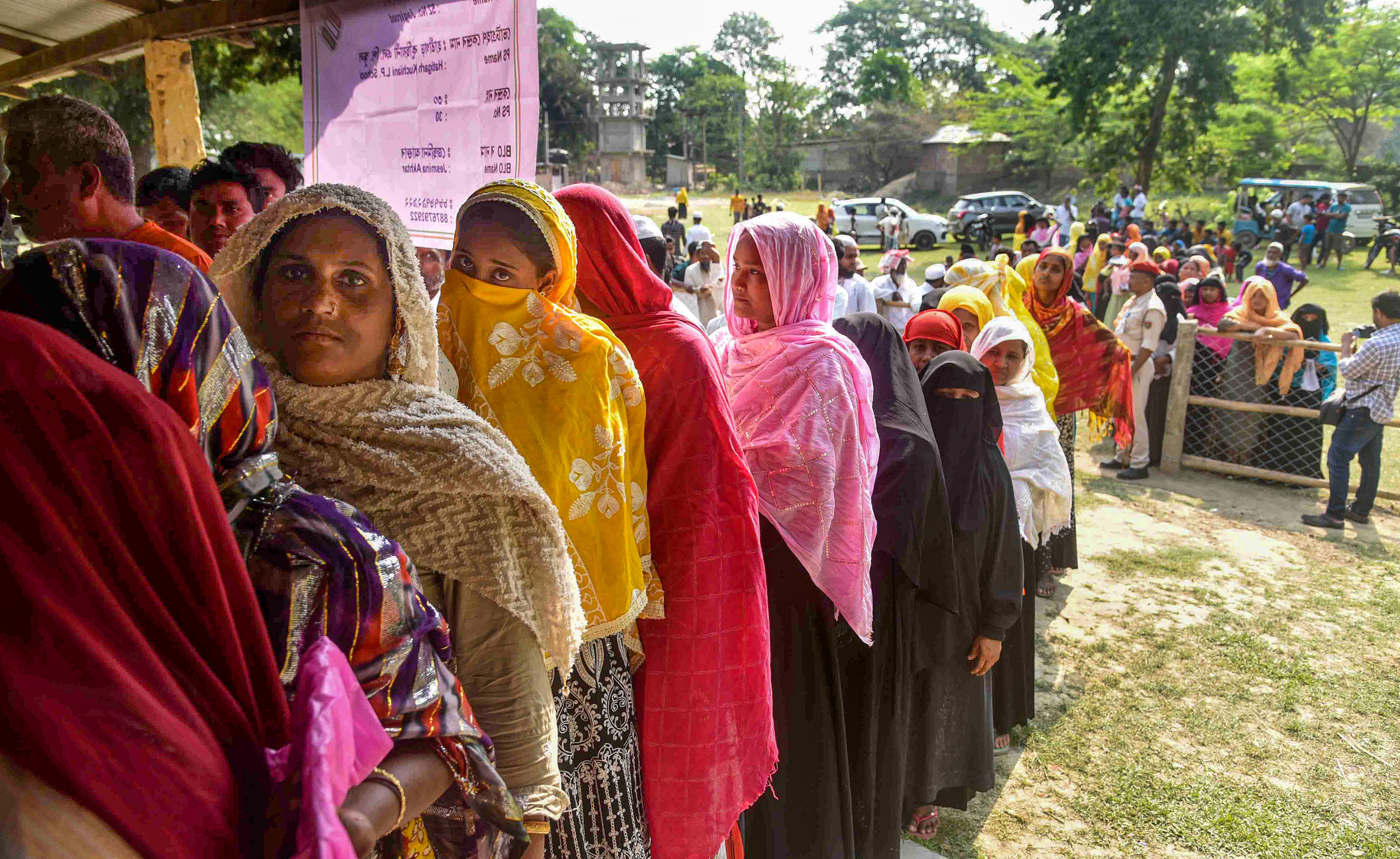 <div class="paragraphs"><p>Voters queue to vote at a polling booth in Assam. Image for representational purposes.</p></div>