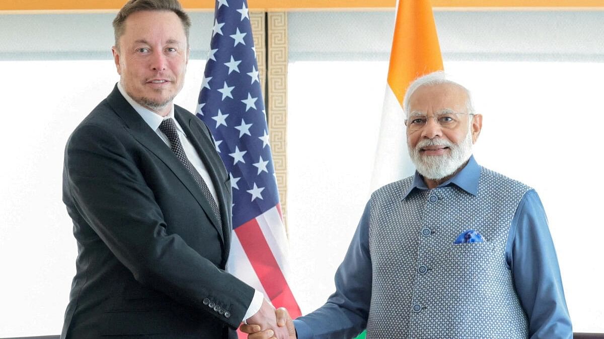 <div class="paragraphs"><p>File photo of PM  Narendra Modi with Tesla boss Elon Musk</p></div>