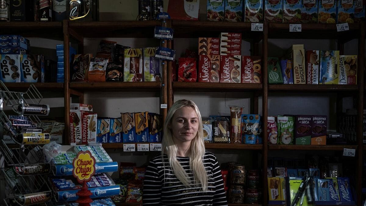 <div class="paragraphs"><p>Marija Jankucic, 20, who is a student, poses for a picture inside the grocery shop where she works, in the village of Krivelj, Serbia.</p></div>