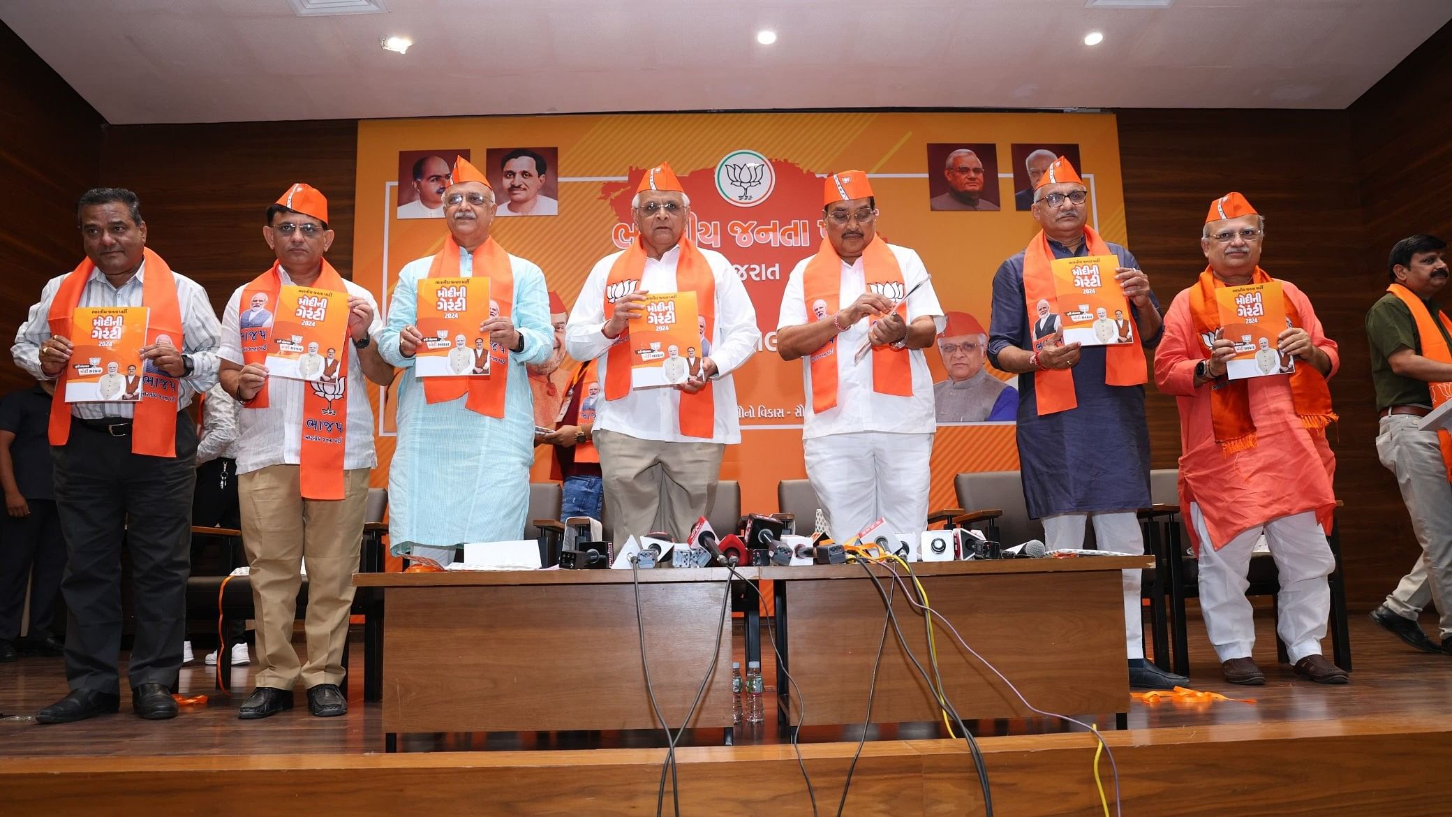 <div class="paragraphs"><p>Gujarat Chief Minister Bhupendra Patel releases the&nbsp;Gujarati version of the BJP manifesto 'Sankalp Patra' and the party's election campaign songs along with&nbsp;state BJP president C R Paatil.</p></div>