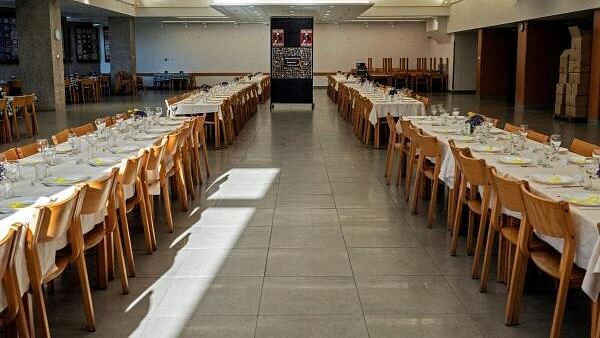 <div class="paragraphs"><p>Passover Seder tables are set with 133 places for hostages kidnapped in the October 7 attack on Israel by the Palestinian Islamist group Hamas, at the dining room of Kibbutz Shamir in northern Israel</p></div>