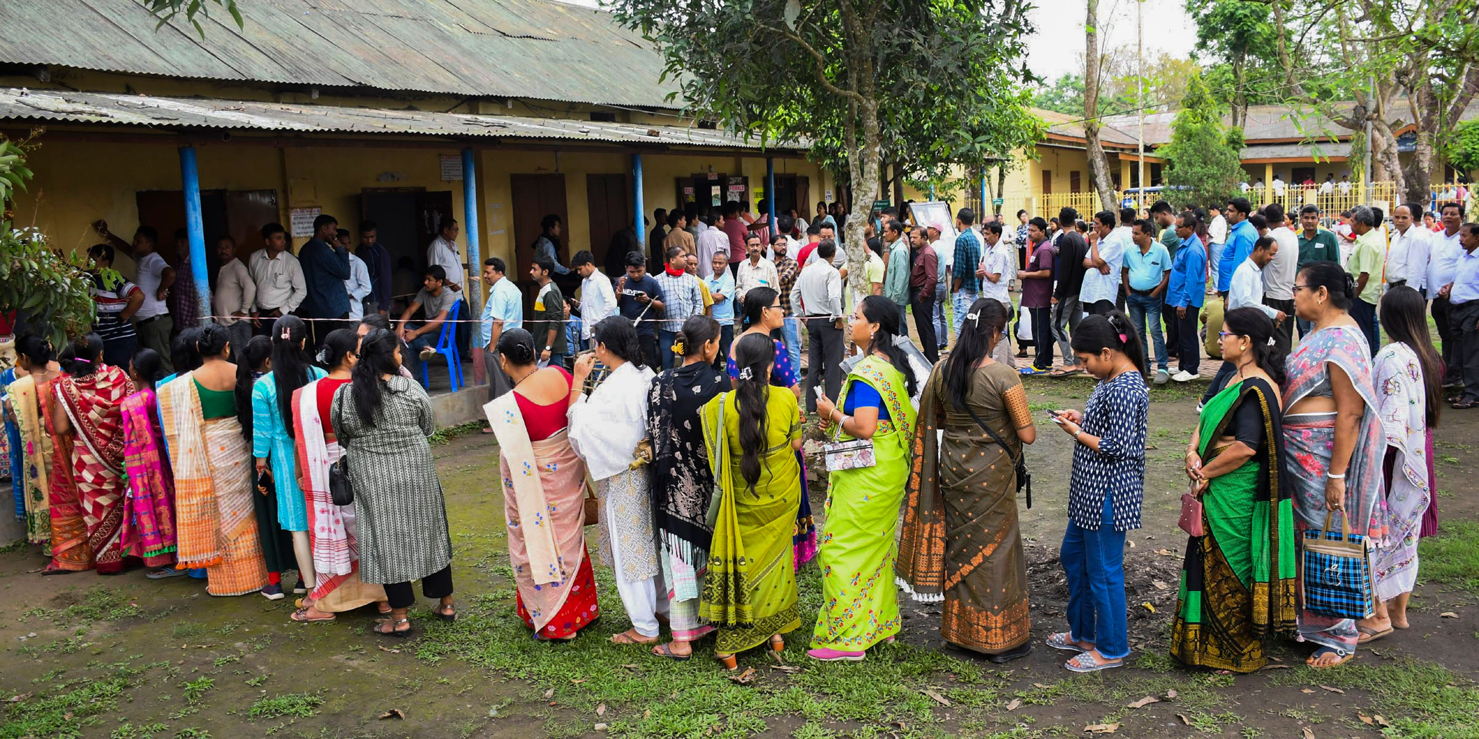 <div class="paragraphs"><p>Dibrugarh: Voters wait in a queue at a polling station to cast their votes for the first phase of Lok Sabha elections, in Dibrugarh district, Friday, April 19, 2024.</p></div>
