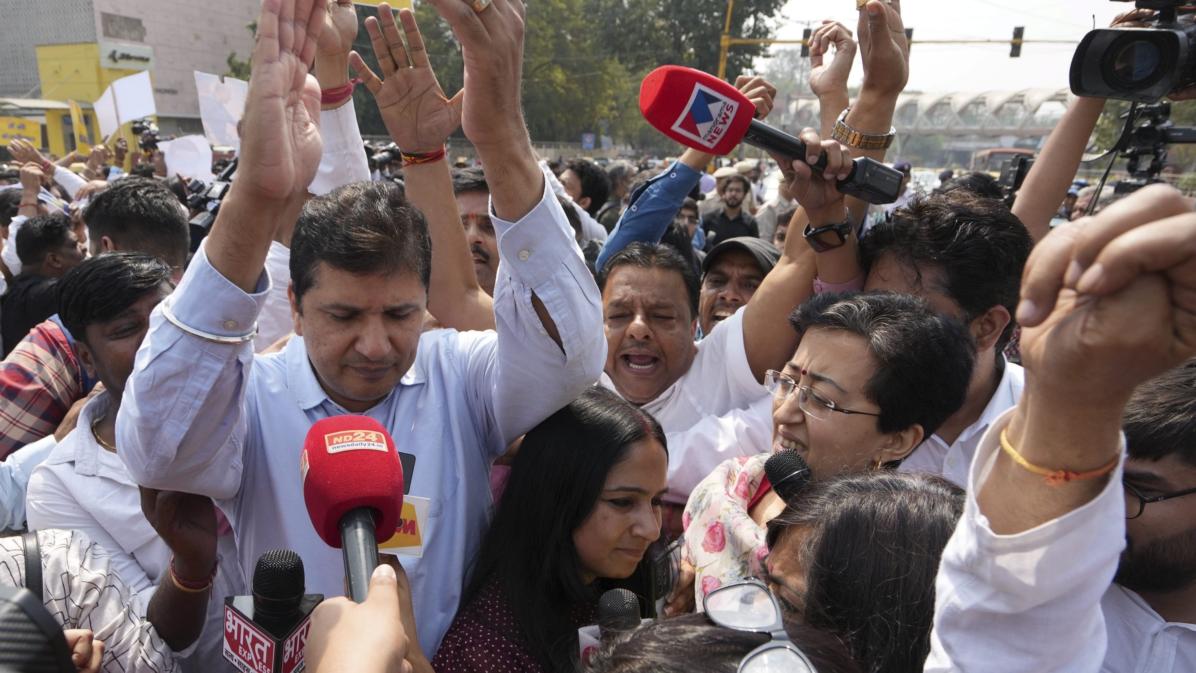 <div class="paragraphs"><p>Delhi Ministers Atishi and Saurabh Bharadwaj with AAP workers stage a protest at ITO against the arrest of Chief Minister Arvind Kejriwal by the Enforcement Directorate (ED) in the money laundering case linked to alleged irregularities in the scrapped Delhi excise policy 2021-22, in New Delhi, Friday, March 22, 2024. </p></div>