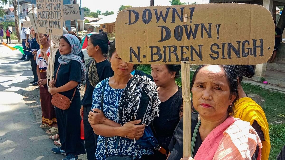 <div class="paragraphs"><p>Kuki tribals holding a placard take part in a rally at Churachandpur in Manipur.&nbsp;</p></div>