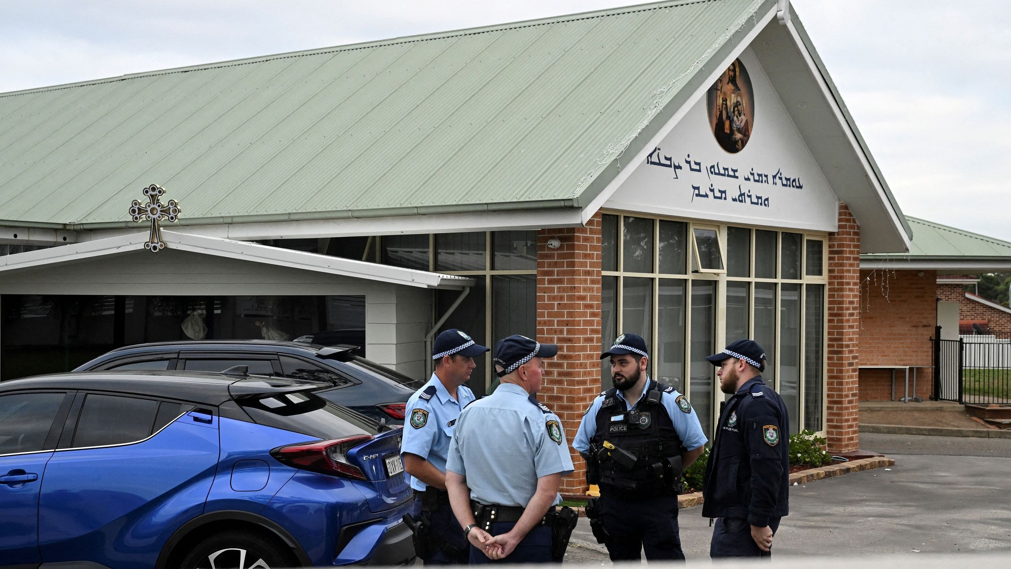 Police stand outside the Assyrian Christ The Good Shepherd Church after a knife attack that took place during a service the night before, in Wakeley in Sydney, Australia, April 16, 2024. REUTERS/Jaimi Joy