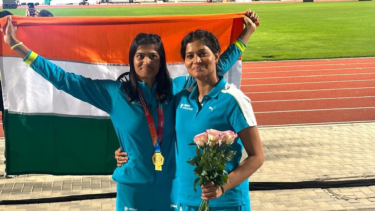 Pavana Nagaraj (left) poses with her mother and Olympian Sahana after winning the long jump gold at the Asian Under-20 Athletics Championships in Dubai on Thursday. 