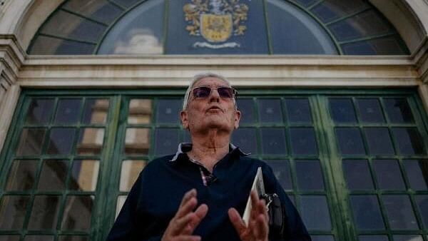 <div class="paragraphs"><p>Colonel Correia Bernardo, one of Portugal's Carnation Revolution militaries named "April Captains", gestures in front of a door of the former Practical Cavalry School in Santarem, from where militaries left towards Lisbon in April 1974 to overthrow Marcelo Caetano's dictatorship, in Portugal, April 15, 2024.</p></div>