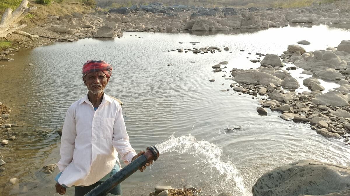 <div class="paragraphs"><p>Farmer Govind Gundkal fills a watering hole with water from his borewell at Tattihalla in Kalghatgi taluk of Dharwad district, to quench the thirst of wild animals.</p></div>
