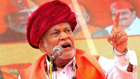 <div class="paragraphs"><p>Union Minister of State and BJP candidate Parshottam Rupala addresses a gathering as he arrives to file his nomination papers for Lok Sabha elections, in Rajkot, Tuesday, April 16, 2024.</p></div>