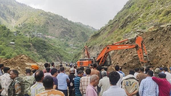 <div class="paragraphs"><p>An excavator being used to clear a road that got blocked after a landslide along the Jammu-Srinagar national highway, near Ramban, Sunday, April 21, 2024.</p></div>