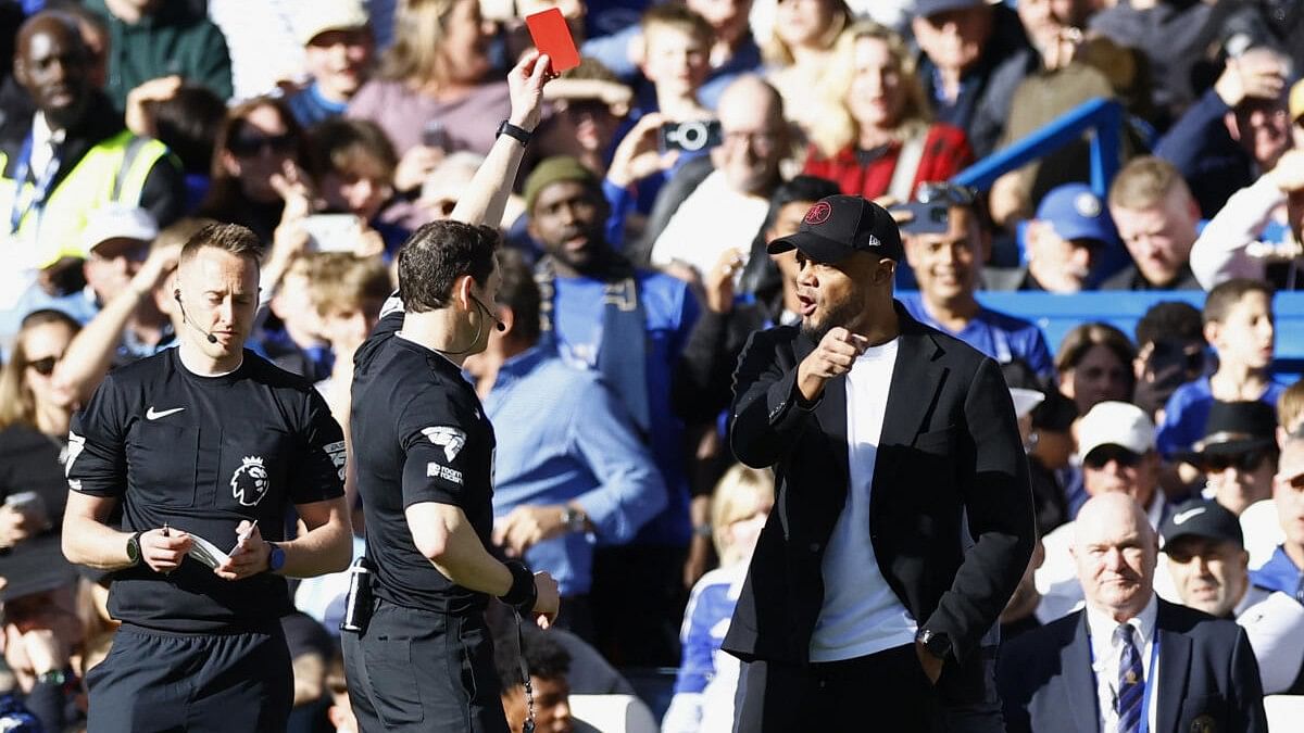 <div class="paragraphs"><p>Burnley manager Vincent Kompany is shown a red card by referee Darren during their Premier League tie against Chelsea.</p></div>