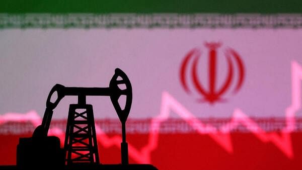 <div class="paragraphs"><p>Iranian flag with stock graph and an oil pump jack miniature model.</p></div>