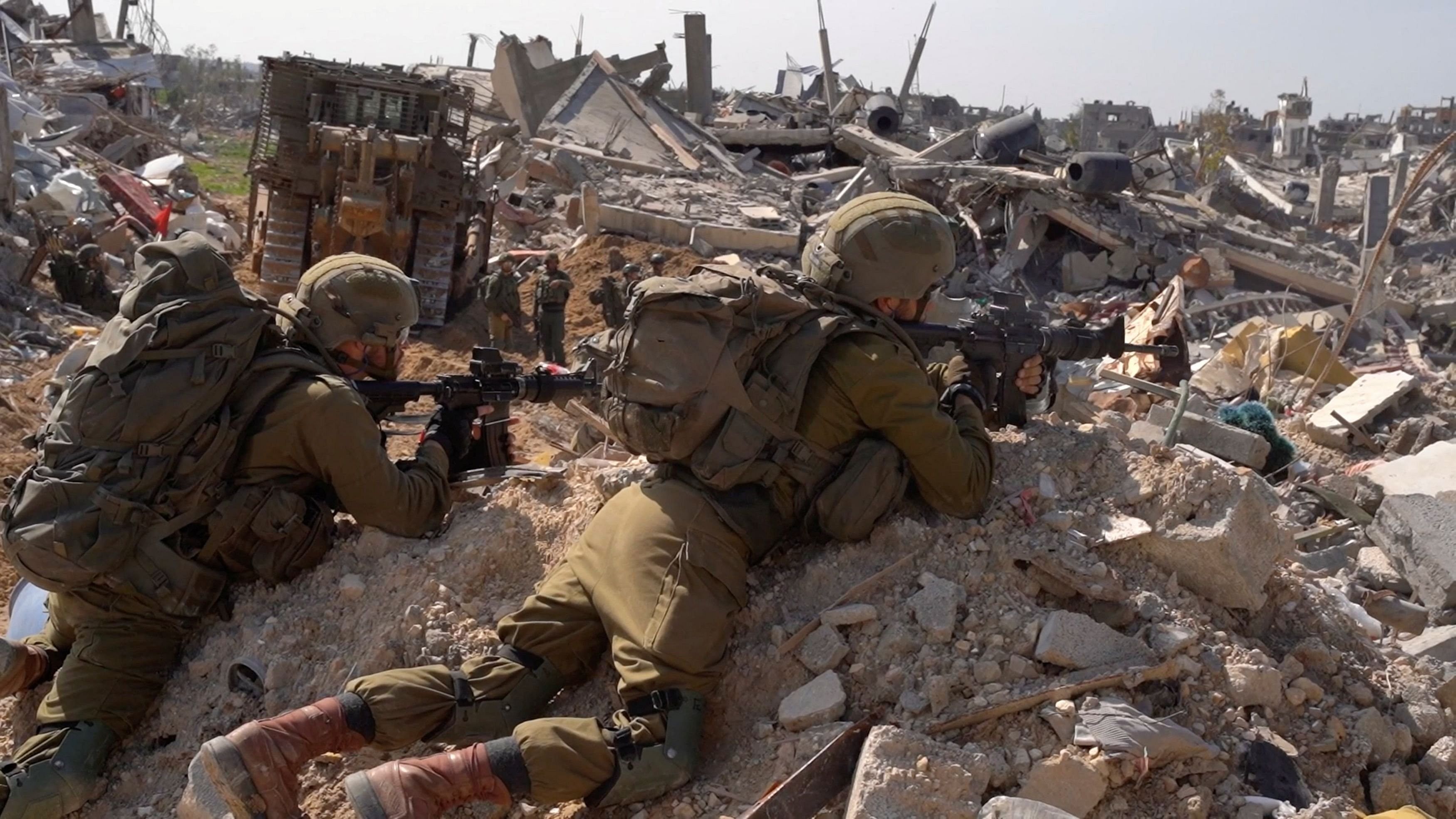 <div class="paragraphs"><p>Israeli soldiers operate amid the ruins of buildings, at  the Gaza Strip.</p></div>