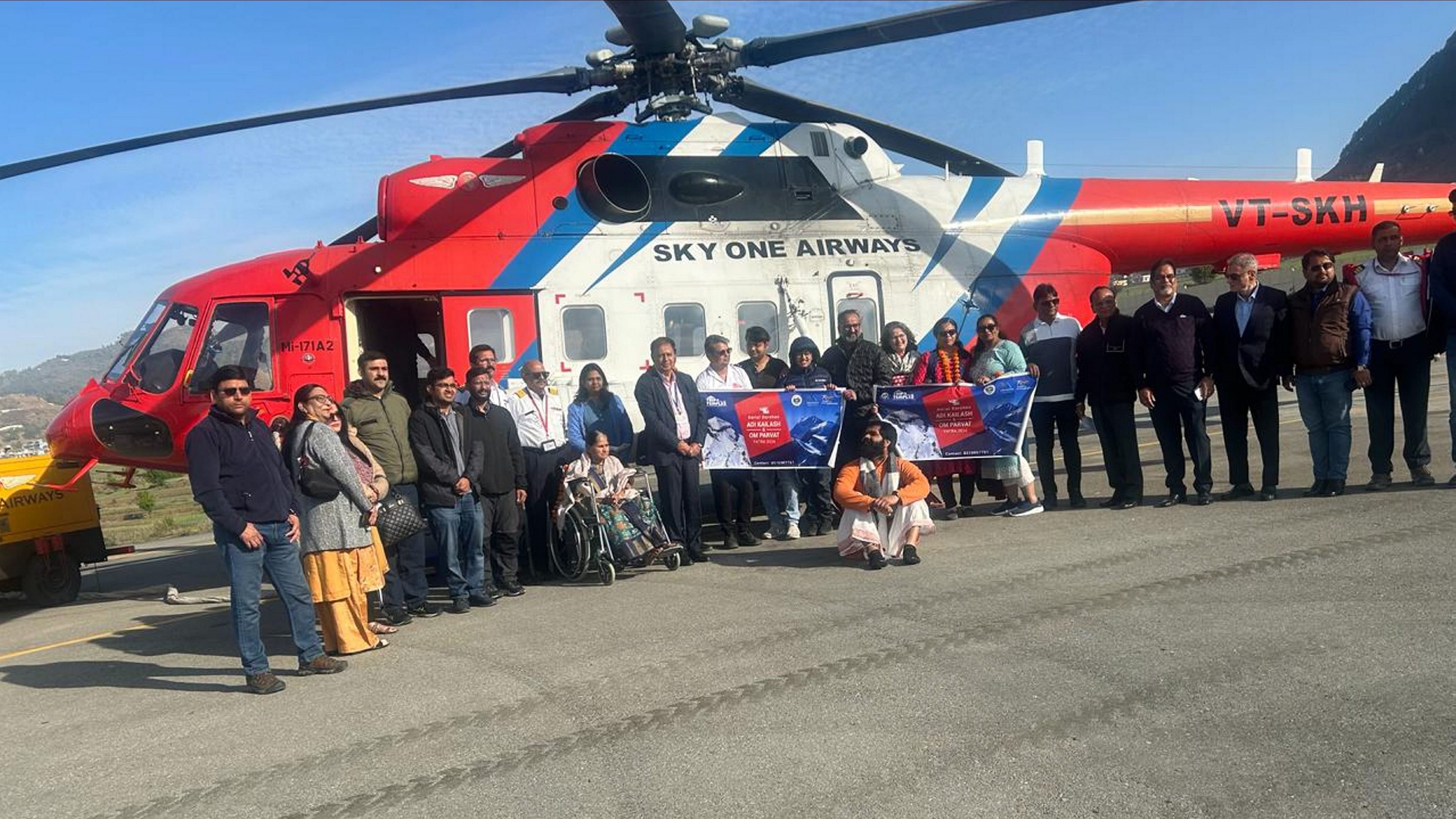 <div class="paragraphs"><p> Pilgrims pose for photos after the launch of helicopter services to the peaks of Adi Kailash and Om Parvat, in Pithoragarh, Monday, April 1, 2024.</p></div>