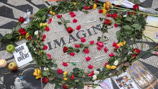 <div class="paragraphs"><p>Flowers and other items are left in tribute at the 'Imagine' mosaic memorialising&nbsp;John Lennon in the Strawberry Fields section of Central Park in New York City</p></div>