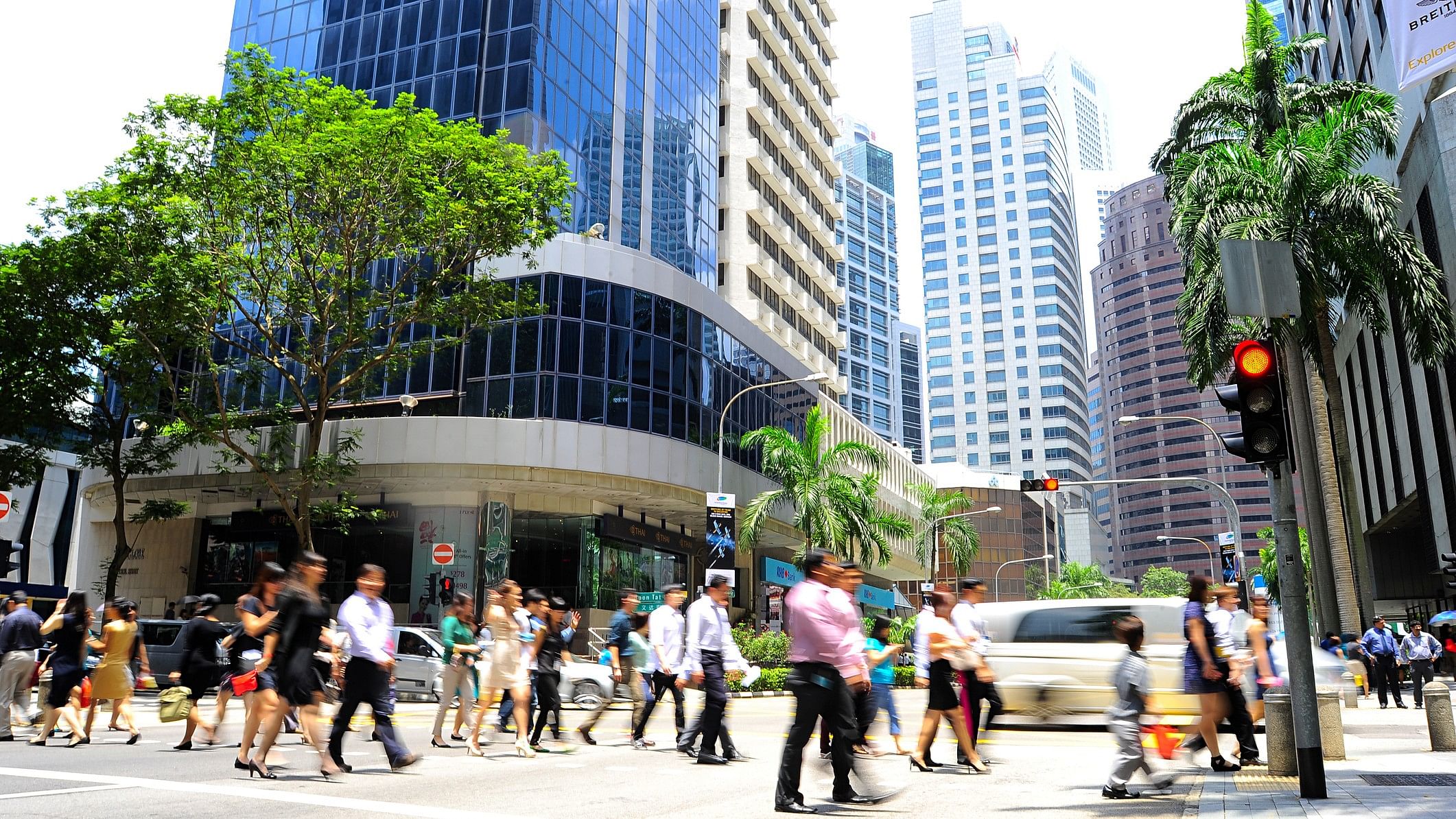 <div class="paragraphs"><p>Representative image shows unidentified businesspeople on a Singapore street</p></div>