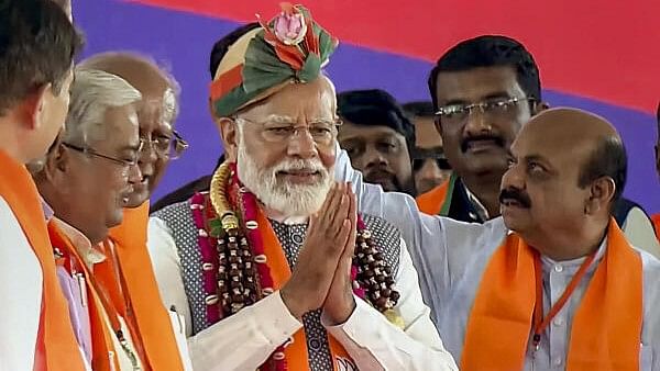 <div class="paragraphs"><p>Prime Minister Narendra Modi with former Karnataka chief minister Basavaraj Bommai and BJP leaders during a public meeting for Lok Sabha elections, in Davanagere, Sunday, April 28.</p></div>