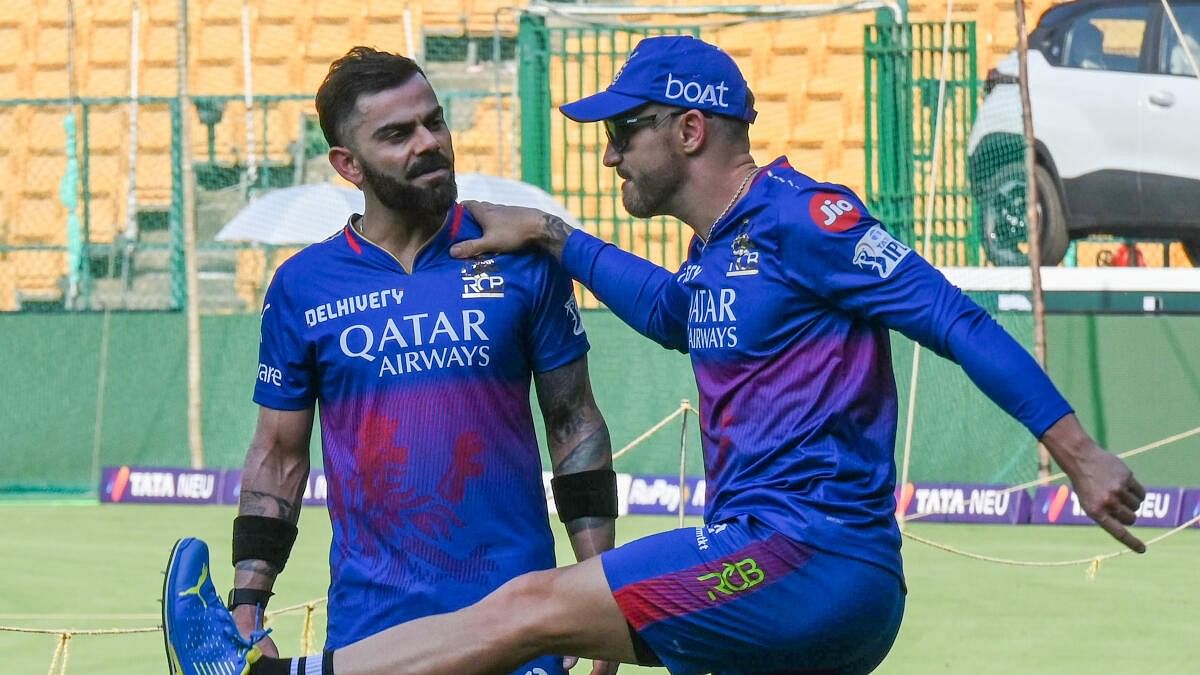 <div class="paragraphs"><p>Faf du Plessis and Virat Kohil share a lighter moment during an RCB practice in Bengaluru.</p></div>