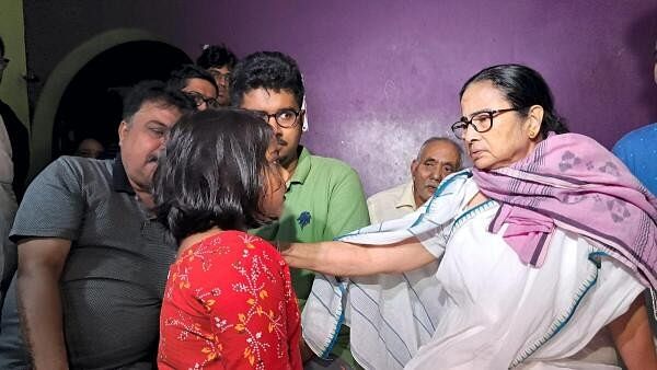 <div class="paragraphs"><p>West Bengal Chief Minister and TMC supremo Mamata Banerjee meets family members of victims of a storm, in Jalpaiguri district, Sunday night, March 31, 2024.</p></div>