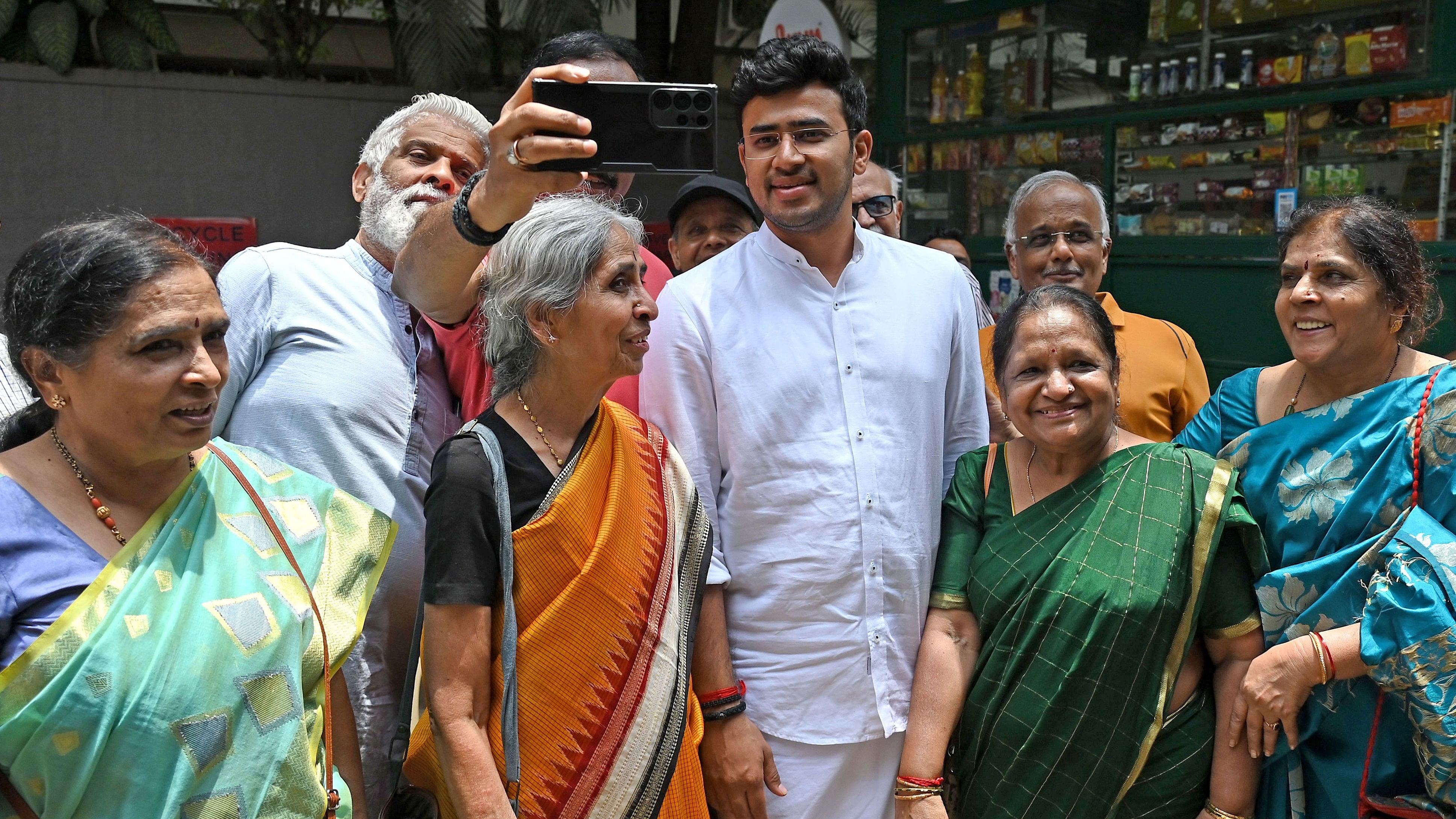 <div class="paragraphs"><p>Bangalore South Lok Sabha constituency BJP candidate Tejasvi Surya interacts with residents of Banashankari on Wednesday.</p></div>