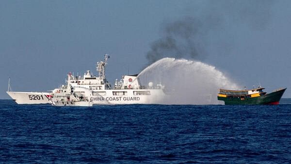 <div class="paragraphs"><p>File Photo showing a Chinese Coast Guard vessels fire water cannons towards a Philippine resupply vessel.</p></div>