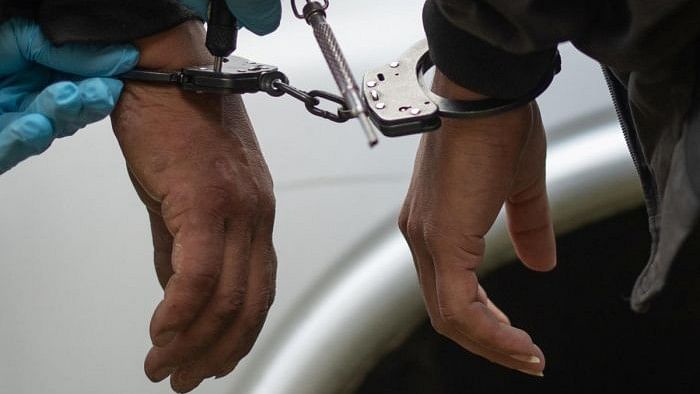 <div class="paragraphs"><p>Representative image showing two persons handcuffed.</p></div>