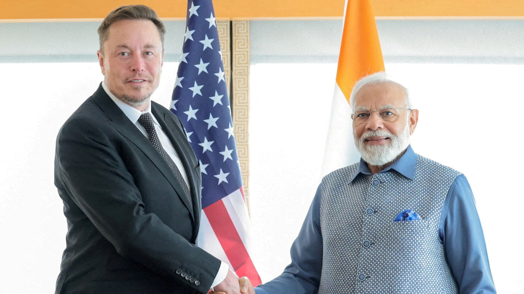 <div class="paragraphs"><p>File photo of India's Prime Minister Narendra Modi shakes hands with Tesla chief executive Elon Musk</p></div>