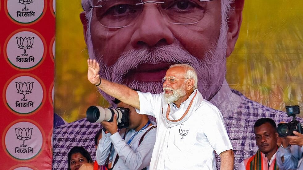 <div class="paragraphs"><p>Prime Minister Narendra Modi waves to supporters during an election campaign rally ahead of the upcoming Lok Sabha polls, in Cooch Behar.&nbsp;</p></div>