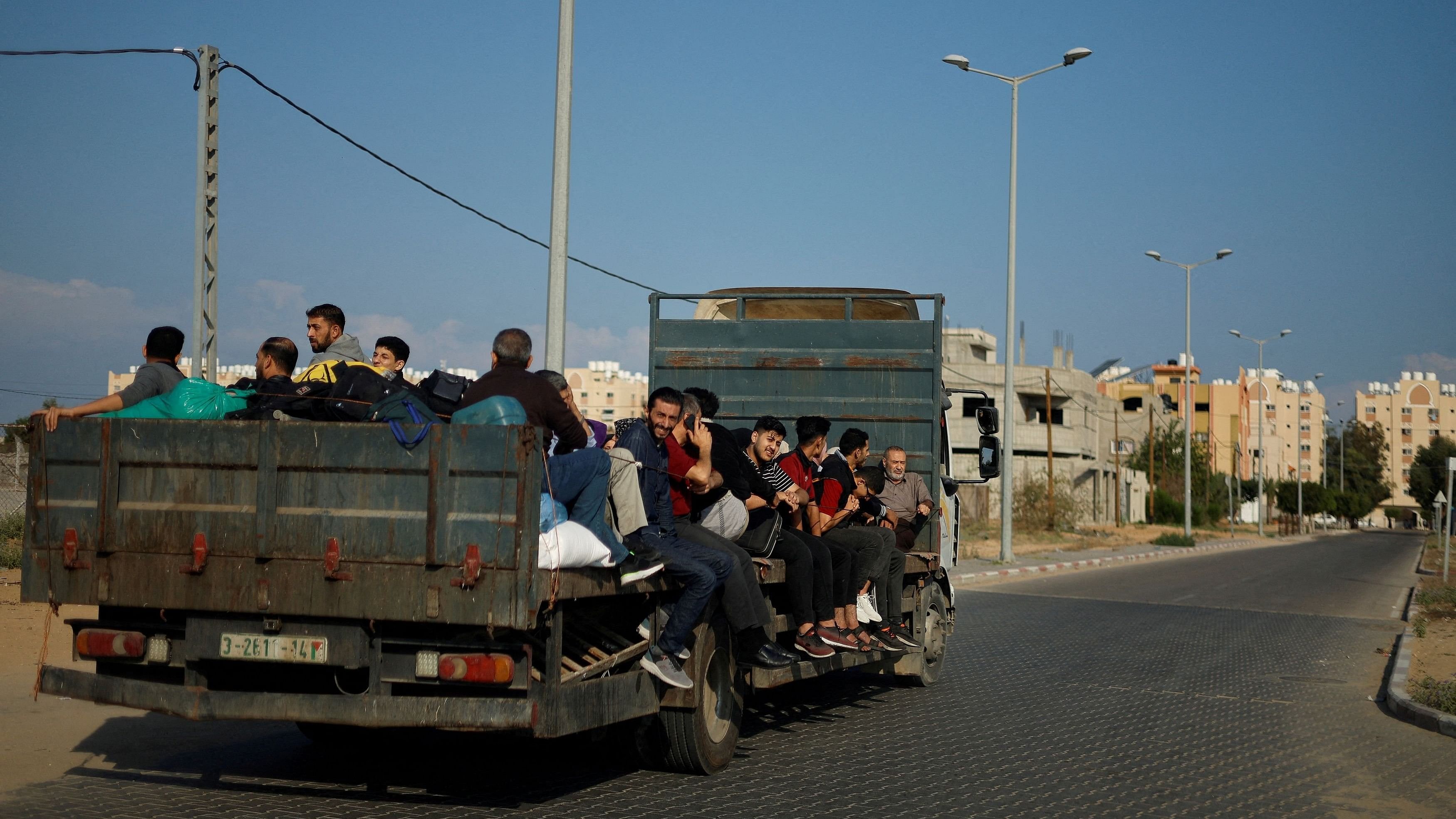 <div class="paragraphs"><p>File photo of Palestinians fleeing their houses amid Israeli strikes.</p></div>