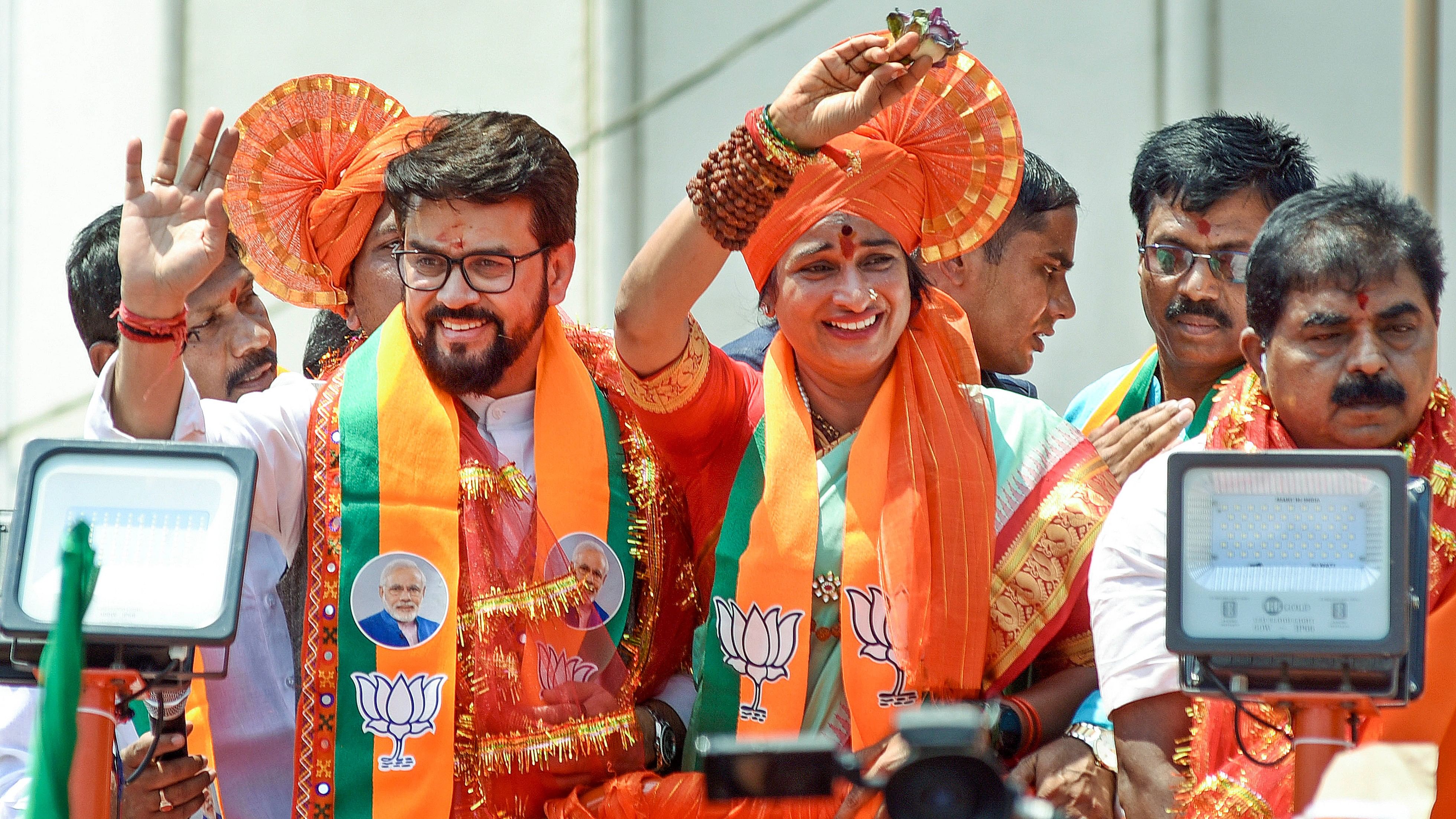 <div class="paragraphs"><p>Union Minister and senior BJP leader Anurag Thakur with party candidate Madhavi Latha during a rally before the latter files her nomination papers for the Lok Sabha elections, in Hyderabad.</p></div>