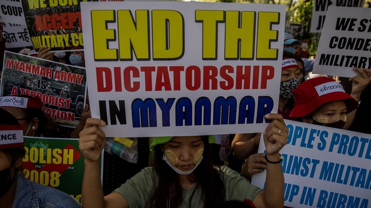 <div class="paragraphs"><p>A file photo of Myanmar citizens living in India holding placards during a protest, organised by Chin Refugee Committee, against the military coup in Myanmar.</p></div>