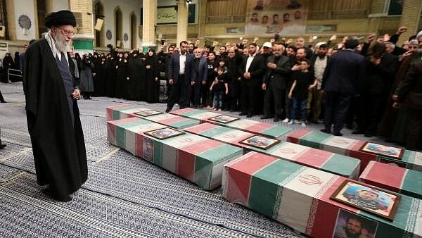 <div class="paragraphs"><p>Iran's Supreme Leader, Ayatollah Ali Khamenei looks at the coffins of members of the Islamic Revolutionary Guard Corps who were killed in the Israeli airstrike on the Iranian embassy complex in the Syrian capital Damascus, during a funeral ceremony in Tehran, Iran April 4, 2024.</p></div>