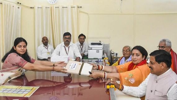 <div class="paragraphs"><p>Union Minister and BJP candidate Smriti Irani files her nomination for Lok Sabha elections, in Amethi, Monday, April 29, 2024. Madhya Pradesh Chief Minister Mohan Yadav is also seen. </p></div>