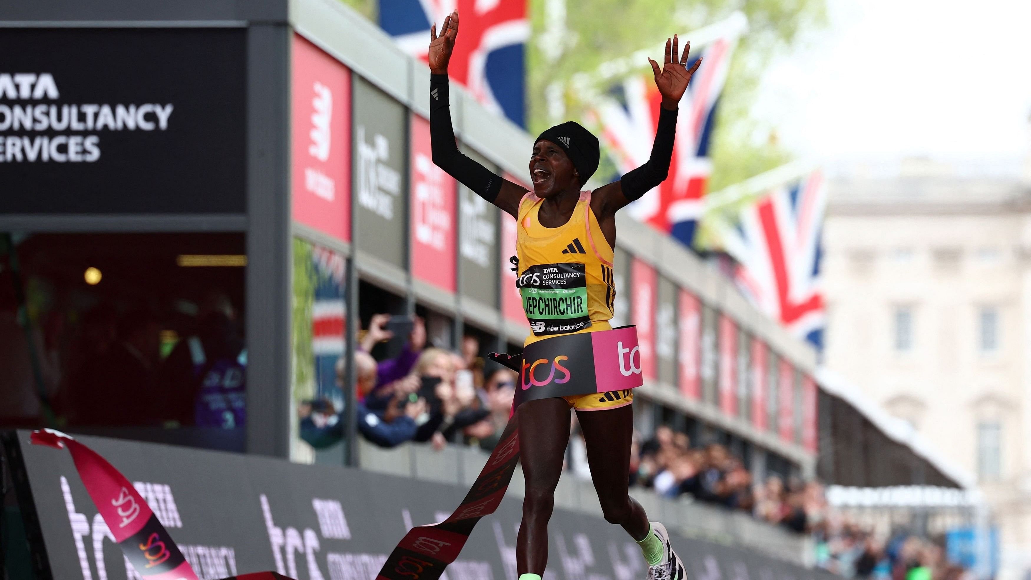 <div class="paragraphs"><p>  Kenya's Peres Jepchirchir crosses the finish line to win the women's elite race </p></div>