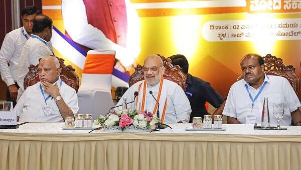 <div class="paragraphs"><p>Union Home Minister Amit Shah with BJP leader B.S. Yediyurappa and Janata Dal (Secular) leader HD Kumaraswamy during a meeting ahead of Lok Sabha elections, in Bengaluru, Tuesday, April 2, 2024.</p></div>