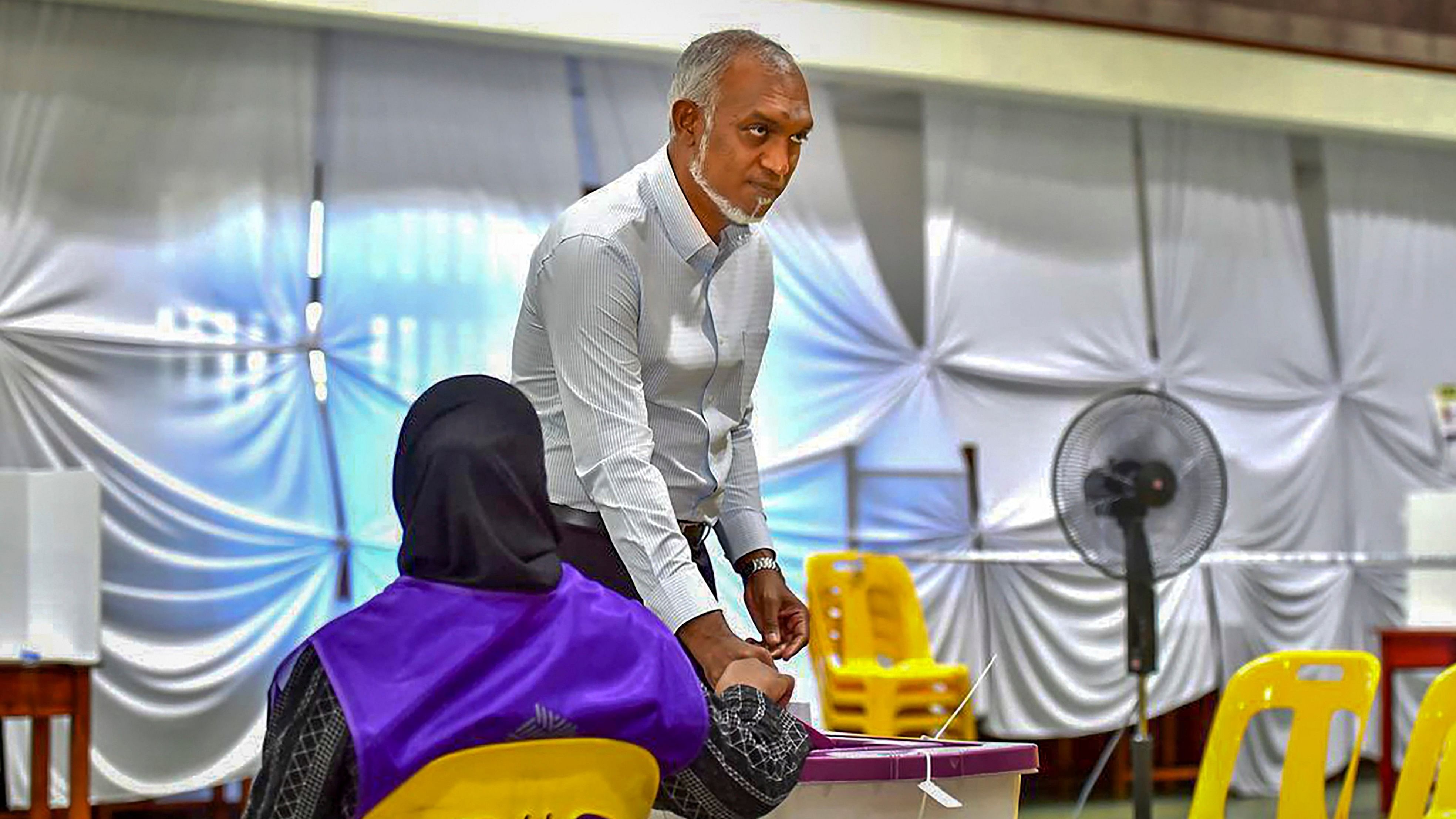<div class="paragraphs"><p>Maldives President Mohamed Muizzu arrives to cast his ballot for parliamentary election at a polling station in Mali, Maldives.</p></div>