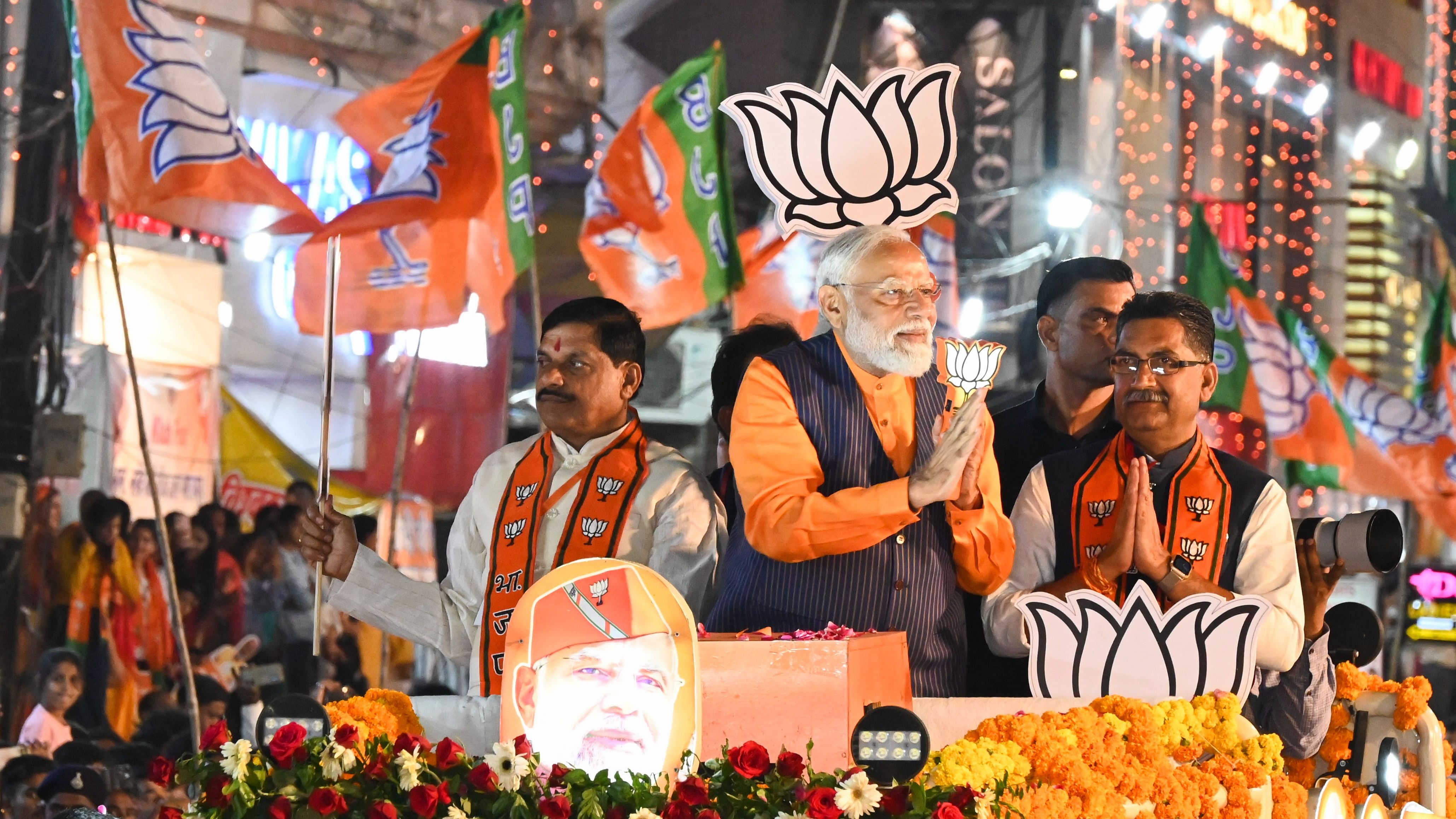 <div class="paragraphs"><p>Prime Minister Narendra Modi with Madhya Pradesh Chief Minister Mohan Yadav and BJP candidate Ashish Dubey during a road show ahead of Lok Sabha elections, in Jabalpur on Sunday.</p></div>