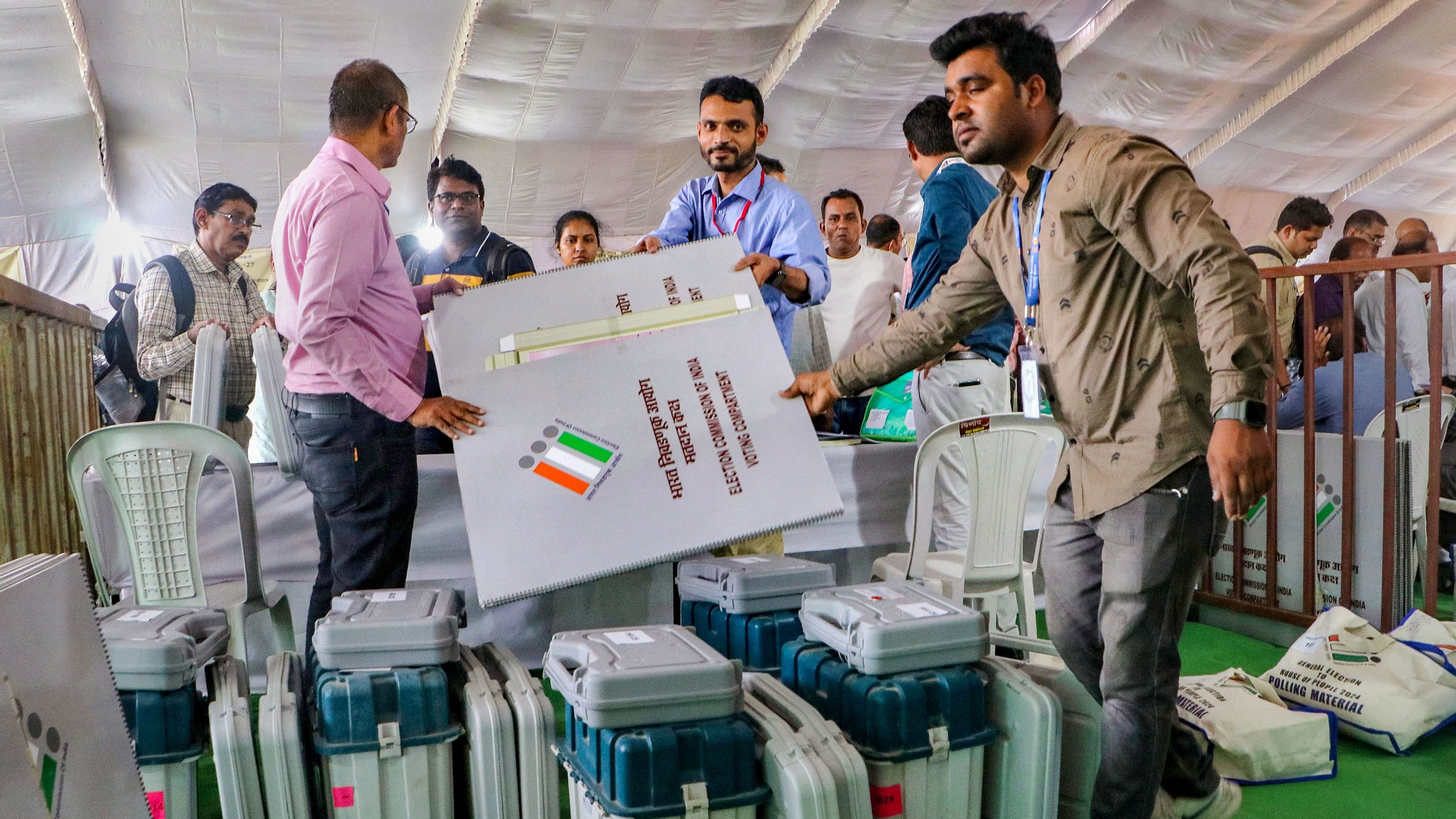 <div class="paragraphs"><p>Nagpur: Polling officials collect Electronic Voting Machines (EVM) and other election material at a distribution centre on the eve of the first phase of Lok Sabha elections, in Nagpur, Thursday, April 18, 2024. </p></div>