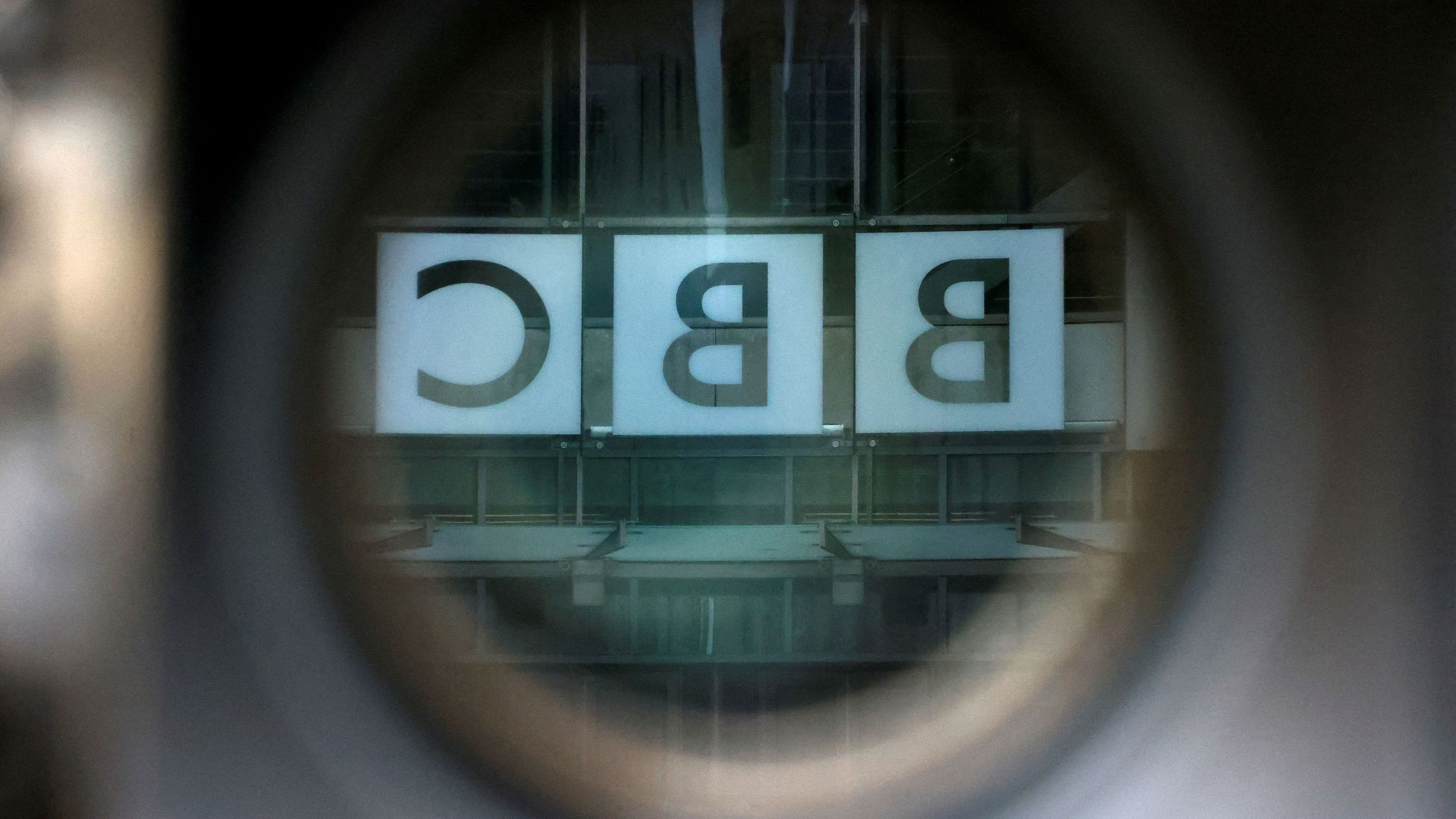 <div class="paragraphs"><p>A BBC logo is reflected in the viewfinder of a television camera outside the British Broadcasting Corporation  headquarters in London. (Representative image)</p></div>