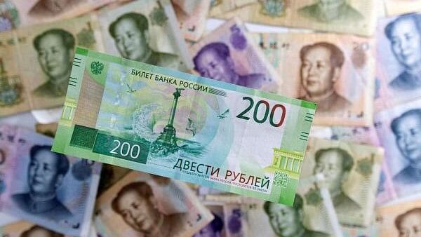 <div class="paragraphs"><p>Russian Rouble banknote is placed on Chinese Yuan banknotes.</p></div>