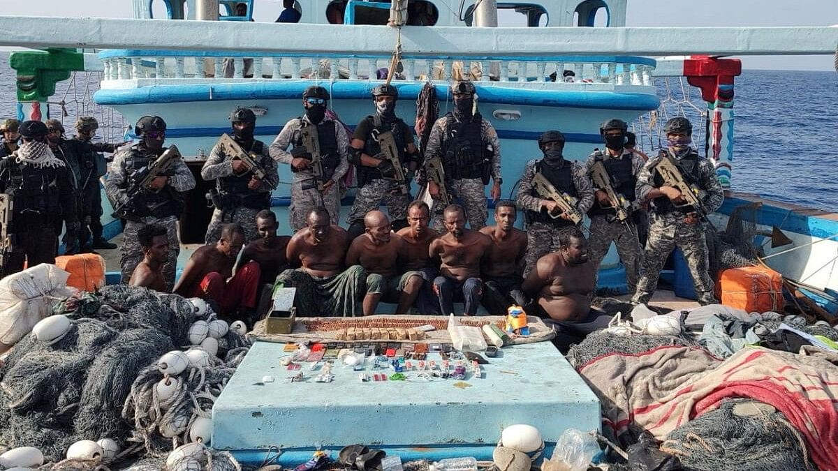 <div class="paragraphs"><p>Members of the Indian Navy pose for a photo as they carried out a rescue operation of an Iranian fishing vessel Al-Kambar 786 after it was seized by armed pirates off Somalia, in the Arabian Sea</p></div>