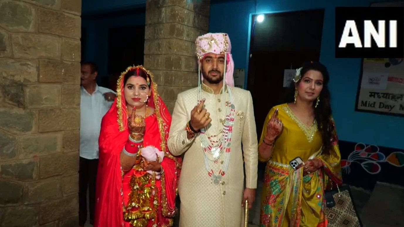 <div class="paragraphs"><p>A newly married couple at a polling booth in J&amp;K's Udhampur.</p></div>
