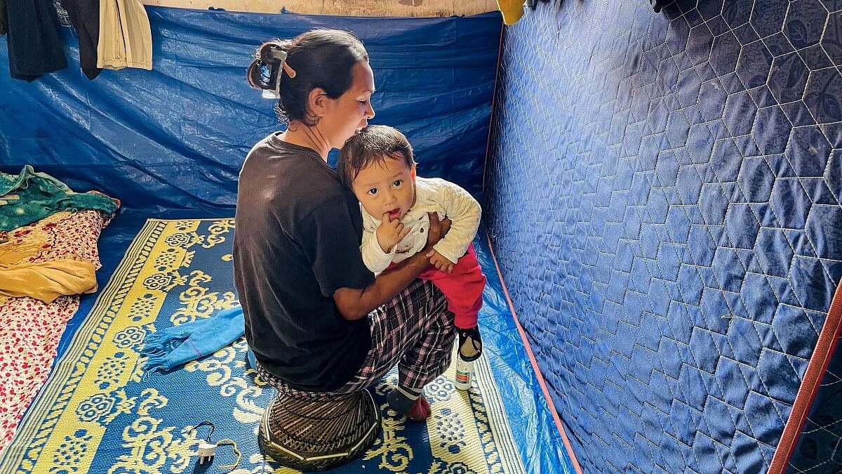 <div class="paragraphs"><p>A woman with her child at a relief camp for people displaced due to ethnic violence in Manipur.</p></div>