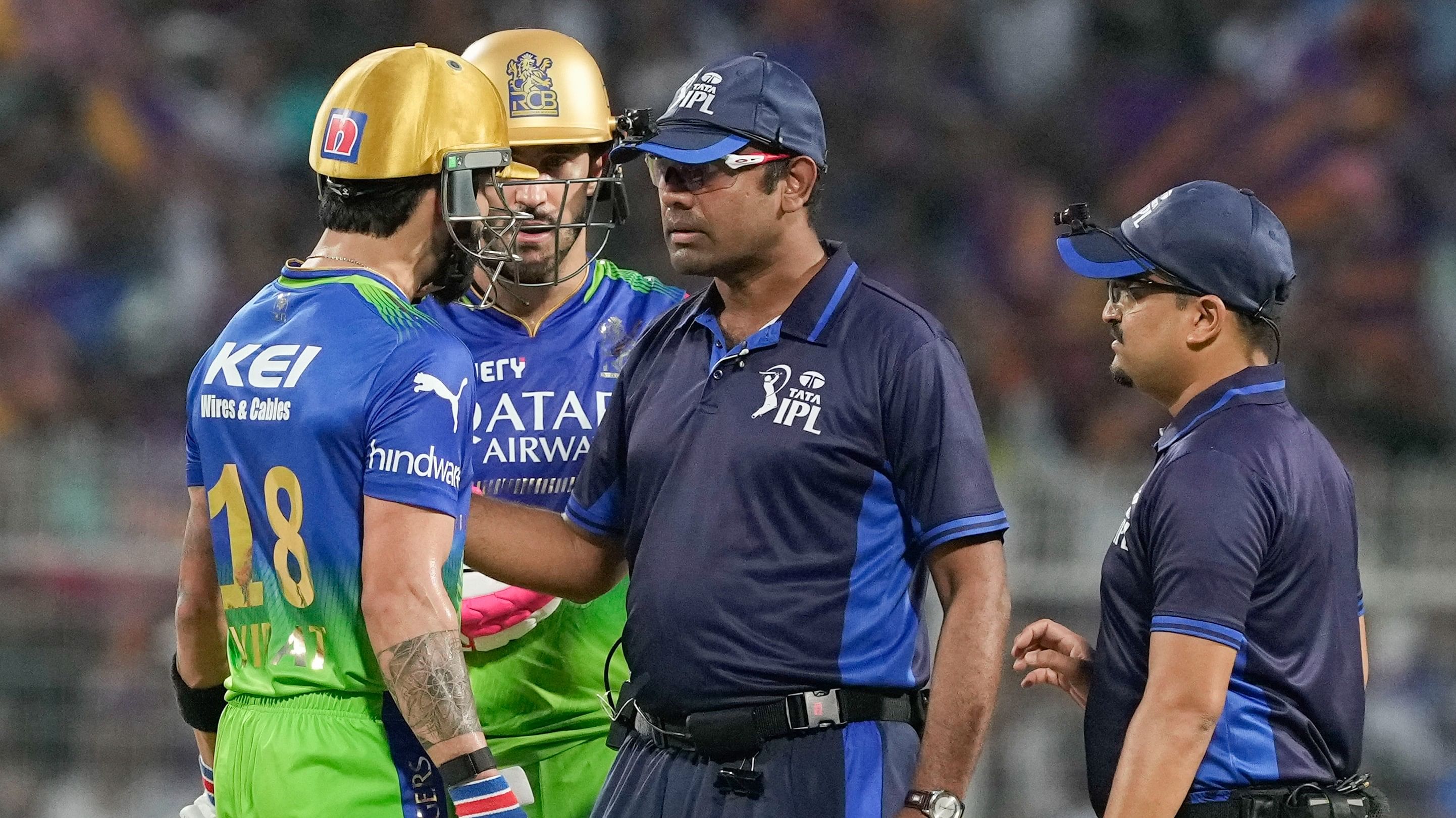 <div class="paragraphs"><p>Royal Challengers Bengaluru's Virat Kohli with captain Faf du Plessis interacts with the Umpires after he was caught and bowled during IPL T20 cricket match between at the Eden Gardens, in Kolkata, on Sunday</p></div>