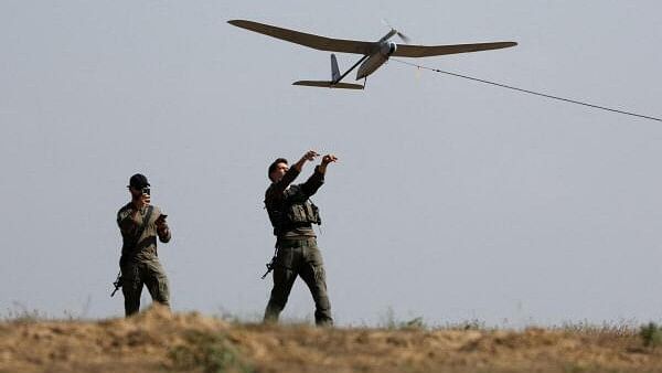 <div class="paragraphs"><p>Israeli soldiers fly a drone near the Israel-Gaza border, amid the ongoing conflict between Israel and the Palestinian Islamist group Hamas, in Israel, April 15, 2024.</p></div>